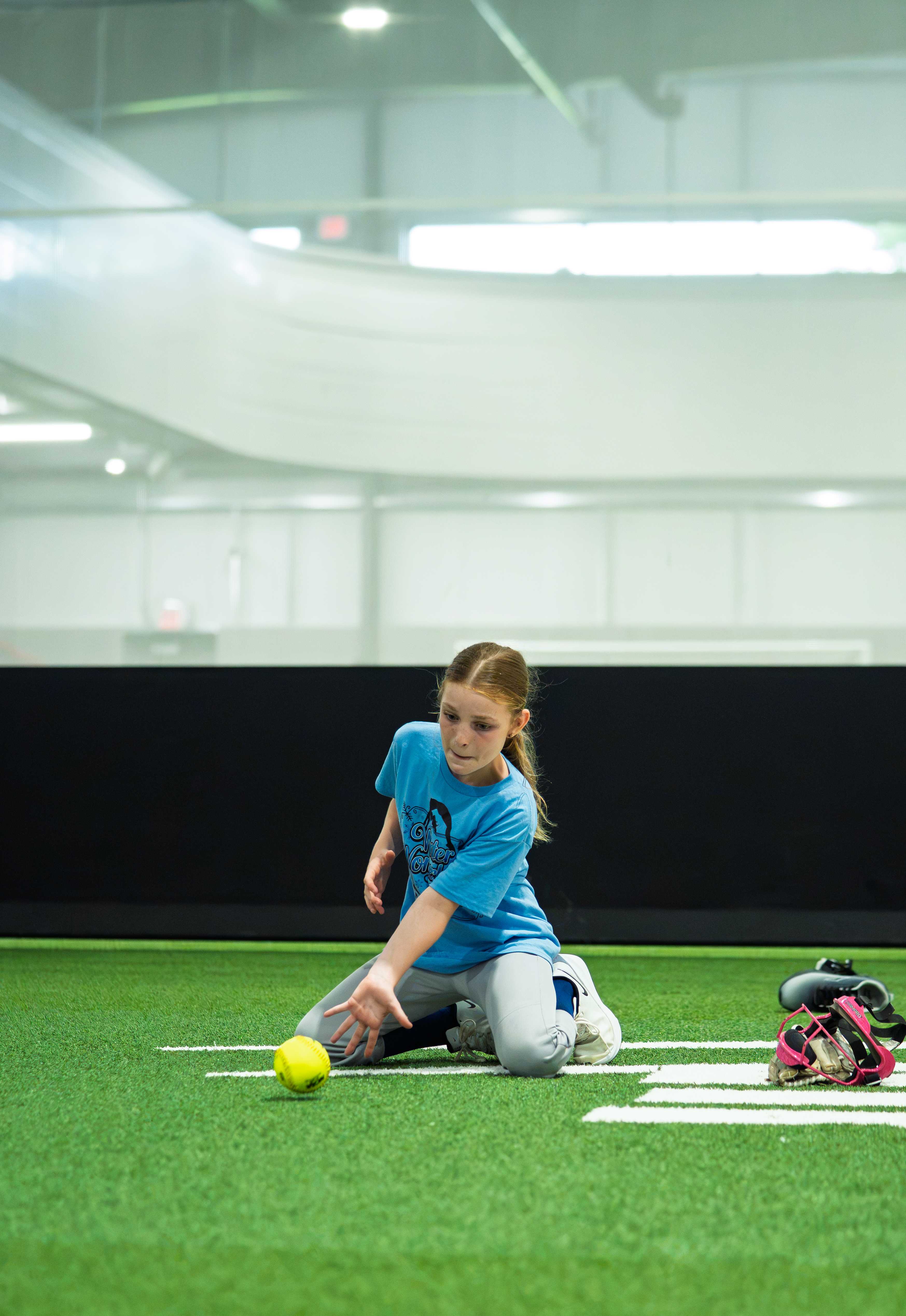 Young player fielding a ground ball during a virtual lesson drill